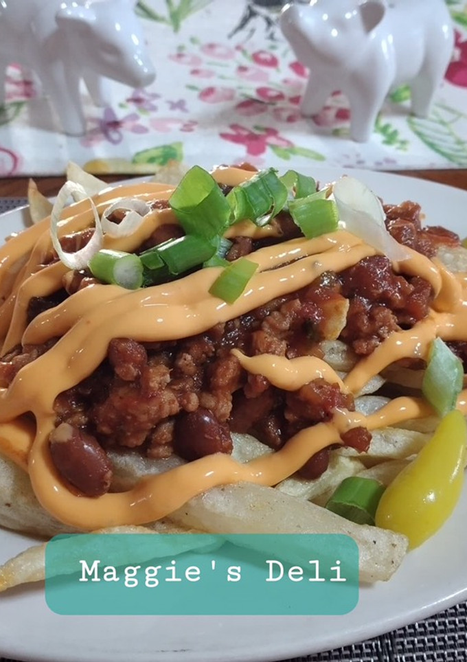 Una foto de Chili cheese fríes
