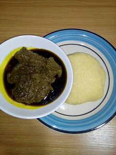 A picture of Black soup with garri.