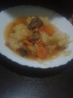 A picture of Plain tain with beef stew.