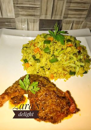 A picture of Vegetable couscous with tandoori chicken.