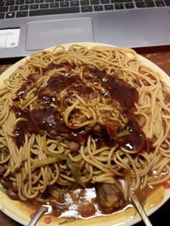 A picture of Wholewheat pasta served with berbeque sauce.