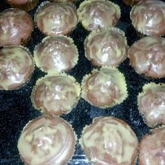 Red and green velvet cupcakes with fudge icing A picture of Red and green velvet cupcakes with fudge icing.