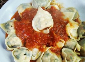 Una foto de Cappelletti de verdura pollo ricota