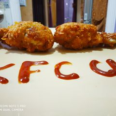 A picture of KFC style fried chicken drumstick.