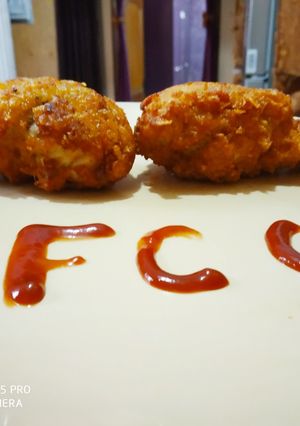 A picture of KFC style fried chicken drumstick.