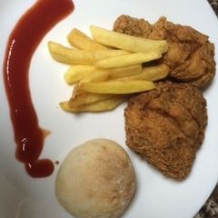 A picture of Homemade Breaded chicken & bread.