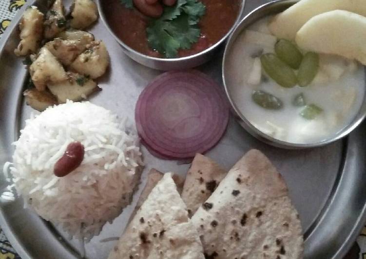 Rajma, rice, sukhe aalu, roti, fruit yoghurt