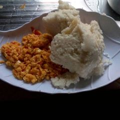 Fried eggs served with Ugali A picture of Fried eggs served with Ugali.