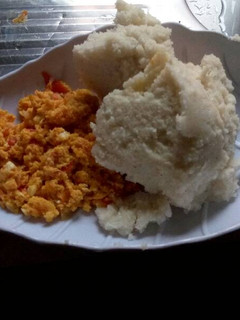 A picture of Fried eggs served with Ugali.