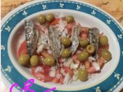 Una foto de jurel en escabeche