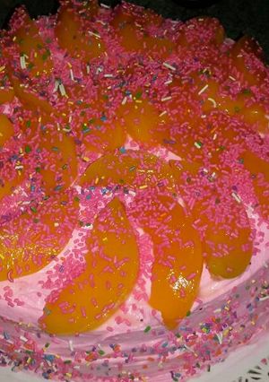 Una foto de Torta de crema y durazno