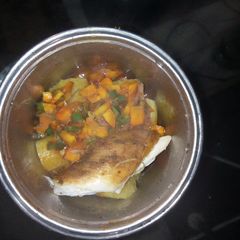 Boiled Plantain garnished with veggie sauce and chicken A picture of Boiled Plantain garnished with veggie sauce and chicken.