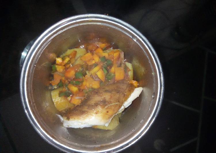 Boiled Plantain garnished with veggie sauce and chicken