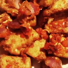A picture of Tofu with sauce.