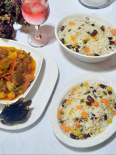 A picture of Butter veg rice with Italian meat ball and potato soup.