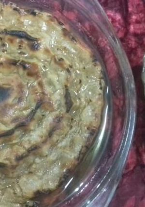 A picture of Rote with spicy aloo gravy.