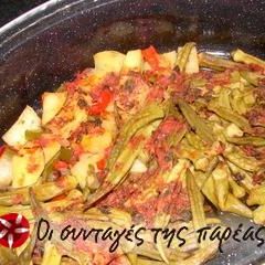 A picture of Okra in a terracotta casserole dish.