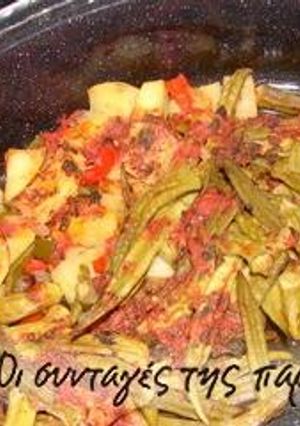 A picture of Okra in a terracotta casserole dish.