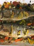 Roast seabass on a bed of roasted vegetables and samphire