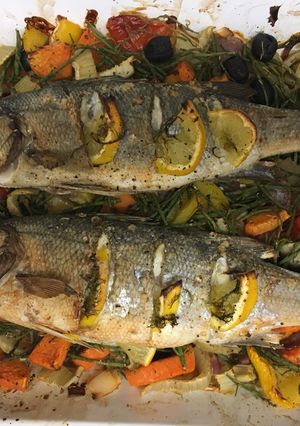A picture of Roast seabass on a bed of roasted vegetables and samphire.