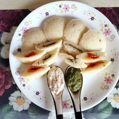 A picture of , Chutney and tomato ketchup filled idli.