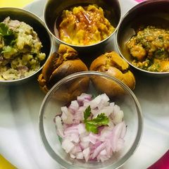 A picture of Exotic Sattu Bati with lavish Tamatar and Aloo Chokha And Masala Dal.