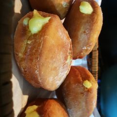 A picture of Donuts filled with vanilla custard ice.