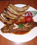 Fried sardine in coconut, tomato sauce and fried green bananas