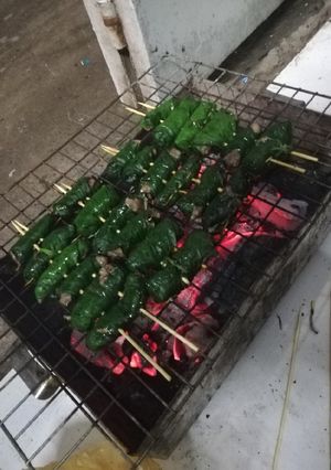 A picture of Grilled Beef Wrapped in Wild Betel Leaves (Bò nướng lá lốp).