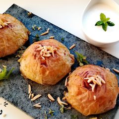 A picture of Oozi \ Quzi \Qoozi, filo wrapped rice.