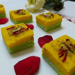 A picture of Two layered kesar pista sandesh.