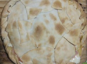 Una foto de Tarta con tapas de empanadas