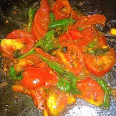 Tawa fry tomato A picture of Tawa fry tomato.