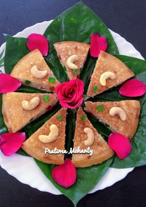 A picture of PODA PITHA (Baked Rice Cake).