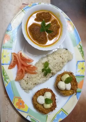 A picture of Ghiya paneer malai kofta with nest and jeera rice.