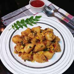 A picture of Schezwan Masala Idli Fry.