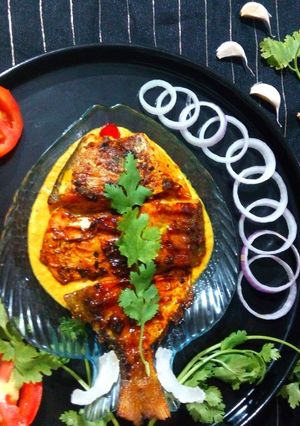 A picture of Grilled Pomfret with Mustard Coconut Sauce.
