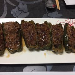 A picture of Hamburger stuffed with green peppers.