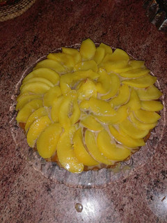 Una foto de Sabrosisima tarta de duraznos y dulce de leche