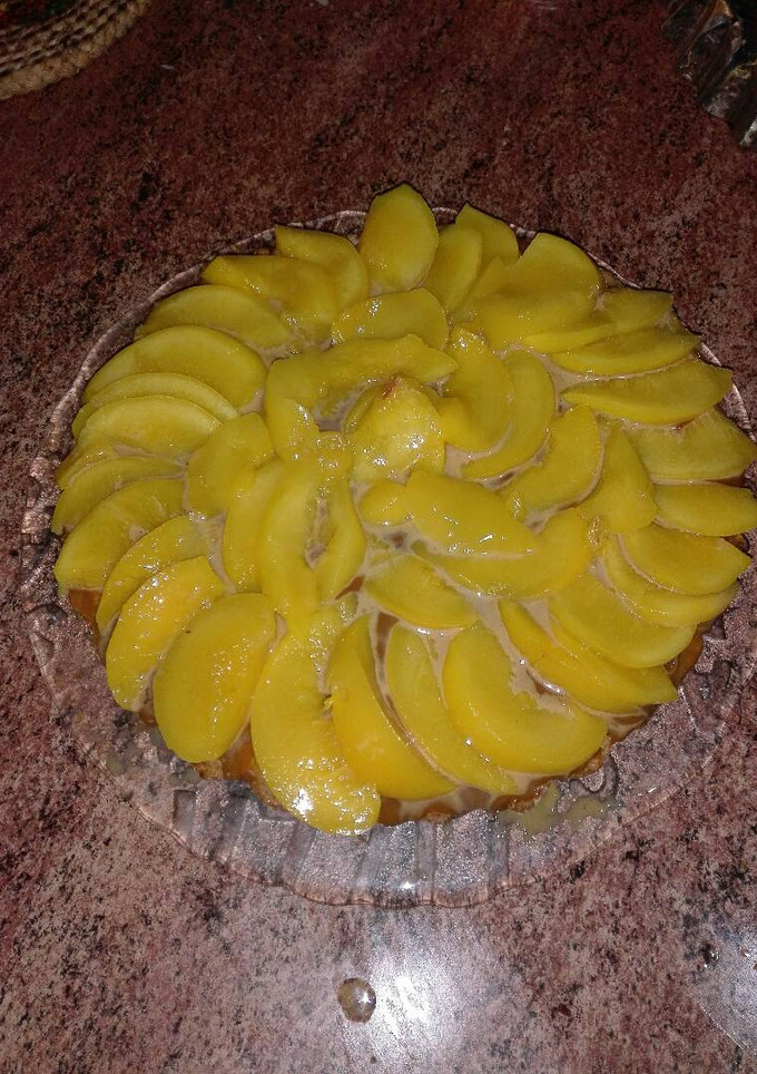 Una foto de Sabrosisima tarta de duraznos y dulce de leche