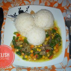 A picture of White rice and veggies beef sauce.