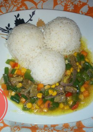 A picture of White rice and veggies beef sauce.