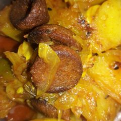 A picture of Potato pumpkin lentil dumplings curry.