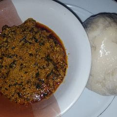 A picture of Egusi soup with ugu and bitter leaf.
