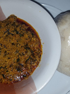 A picture of Egusi soup with ugu and bitter leaf.