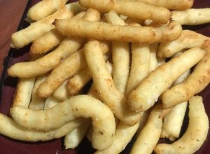 Una foto de Palitos de papa y parmesano