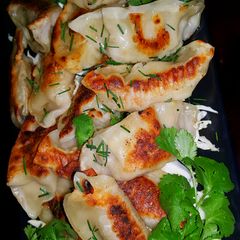 A picture of Mike's Pan Seared Pork Wontons Or Pork Pot Stickers.