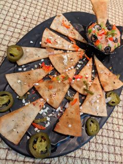 A picture of Chapati tortilla with BBQ dip.