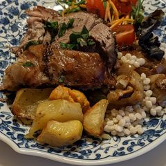 A picture of Roasted Lamb shoulder with giant Couscous & caramelised onions.