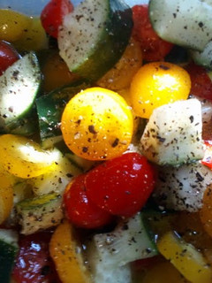A picture of Cherry tomato and cucumber salad.